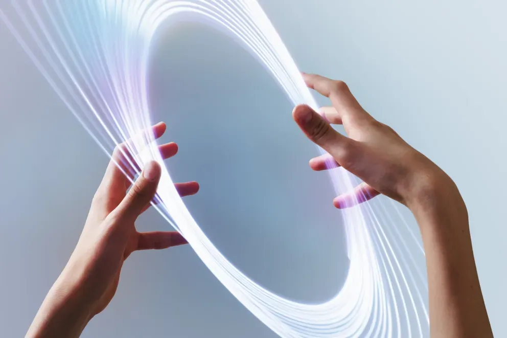 close up of hands touching circular light