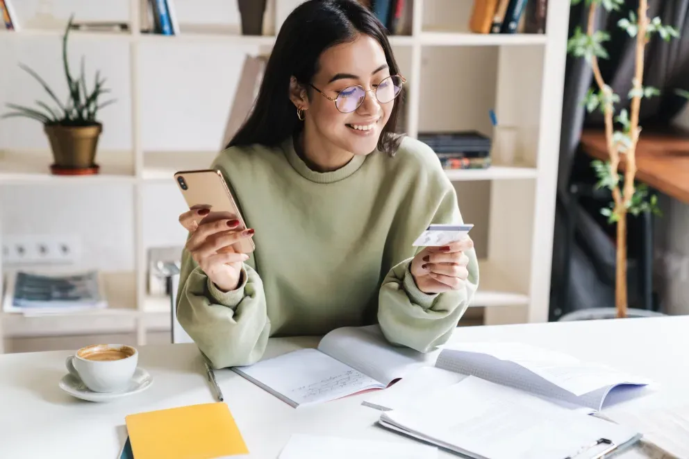 Woman with phone and card Woman with phone and card