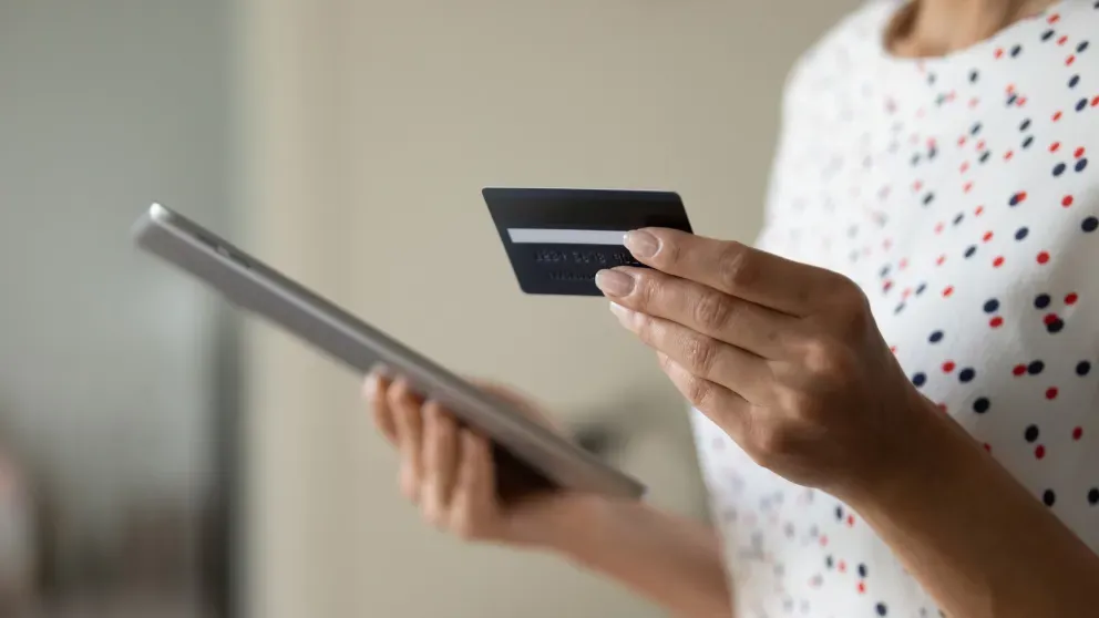 Woman with phone and card Woman with phone and card