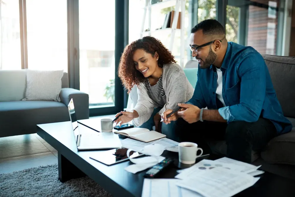 Business meeting with man and woman looking at paperwork Business meeting with man and woman looking at paperwork