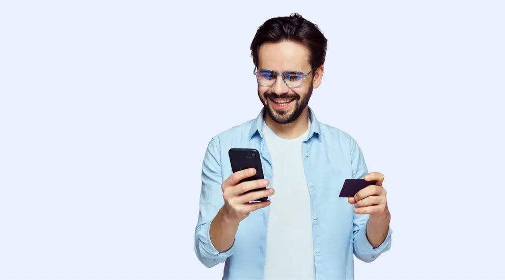 Man with phone and card Man with phone and card