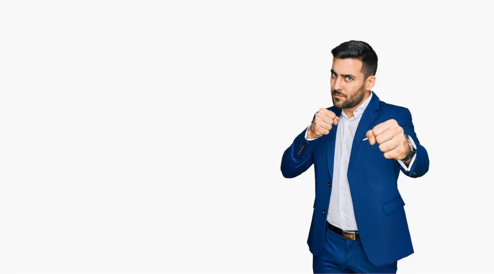Man with fists in suit
