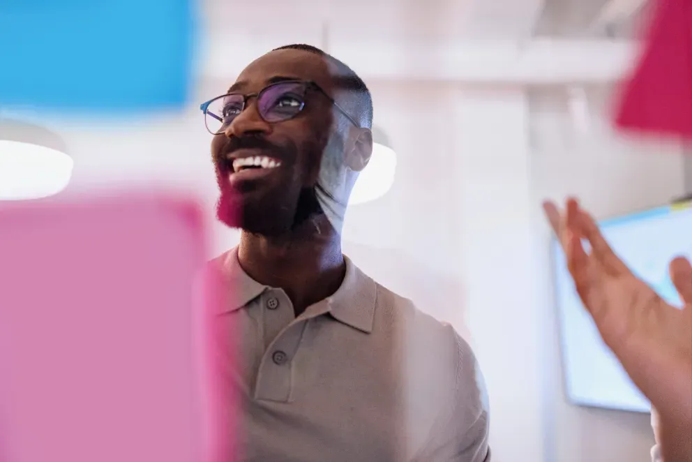 person looking at board of notes