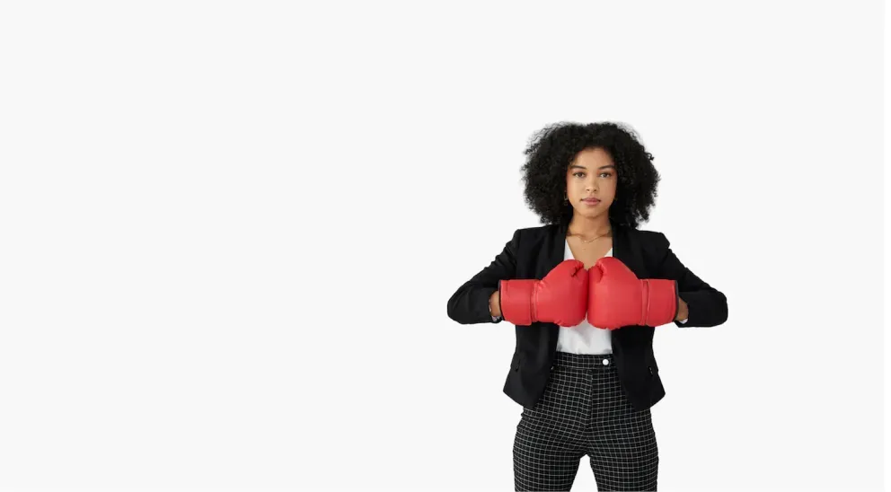 Business woman with boxing gloves
