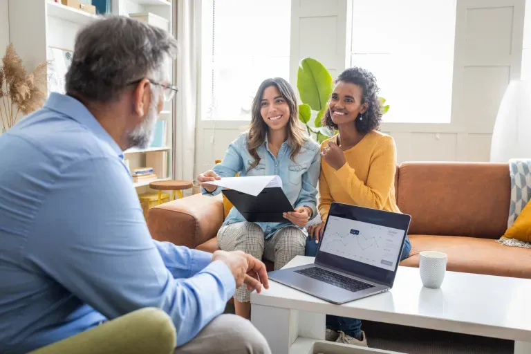 Two women meeting with counselor Two women meeting with counselor