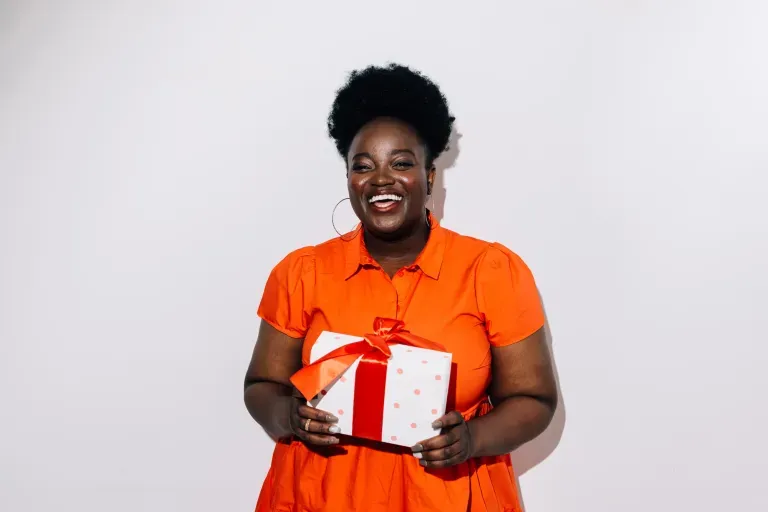 Woman holding holiday gift