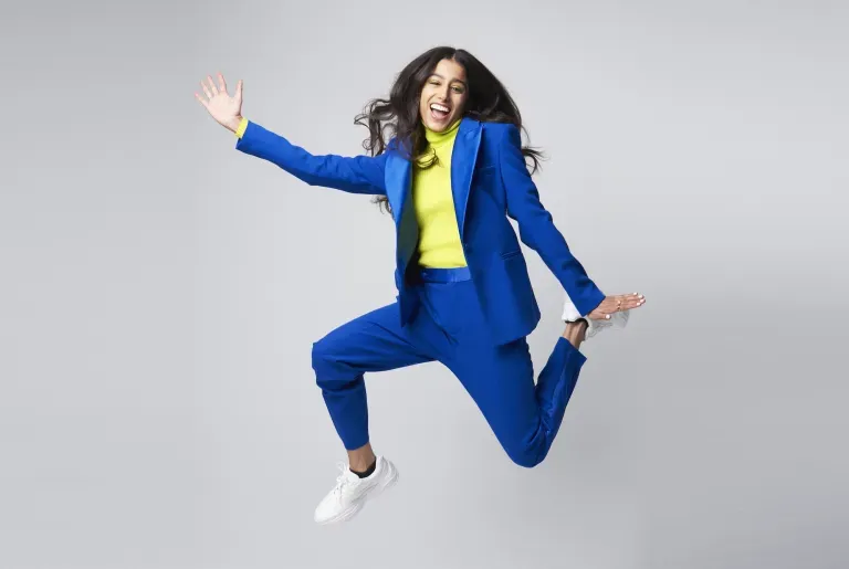 Excited business woman jumping