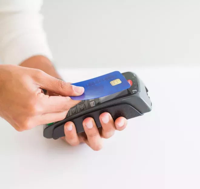 Person paying with a debit card