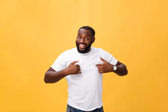 man standing in front of orange background