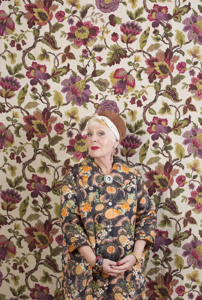 Woman blending in with the wallpaper