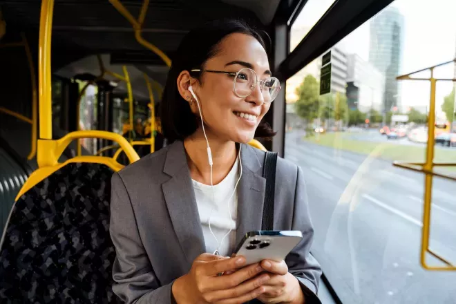woman looking out of bus window