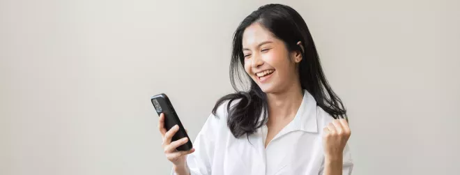 woman looking at cell phone
