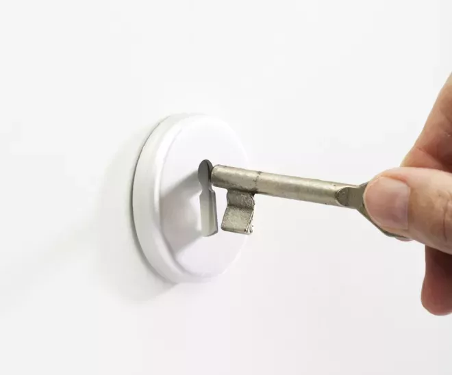 putting key into key hole