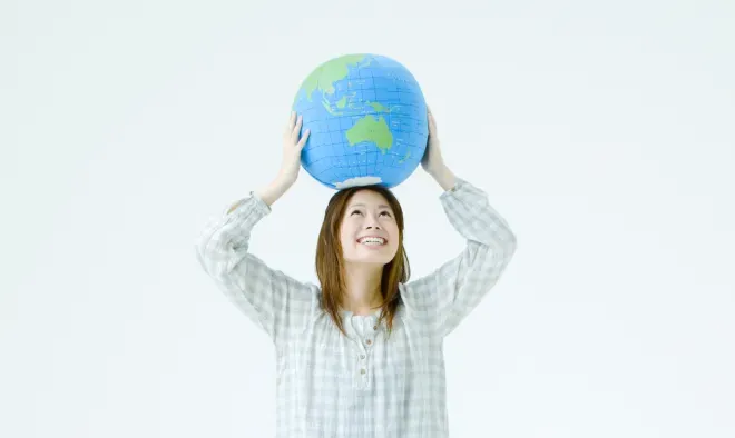 Woman holding world on top of her head Woman holding world on top of her head