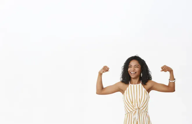 woman flexing her biceps woman flexing her biceps