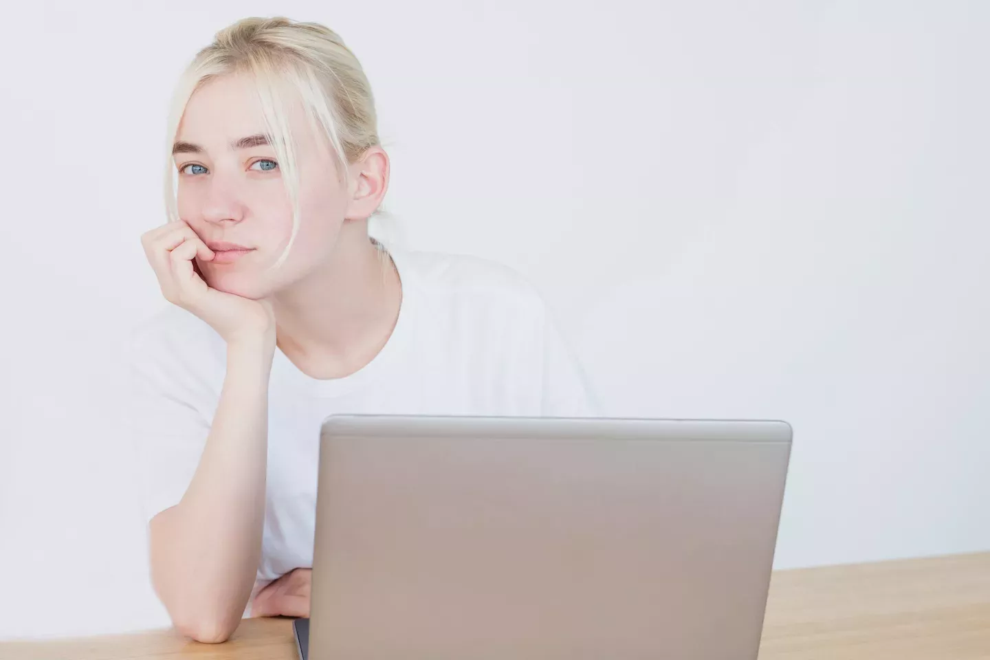 Woman looking up from her laptop