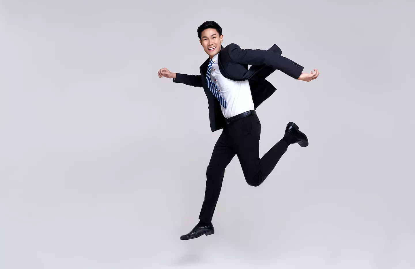 Man jumping in a suit Man jumping in a suit
