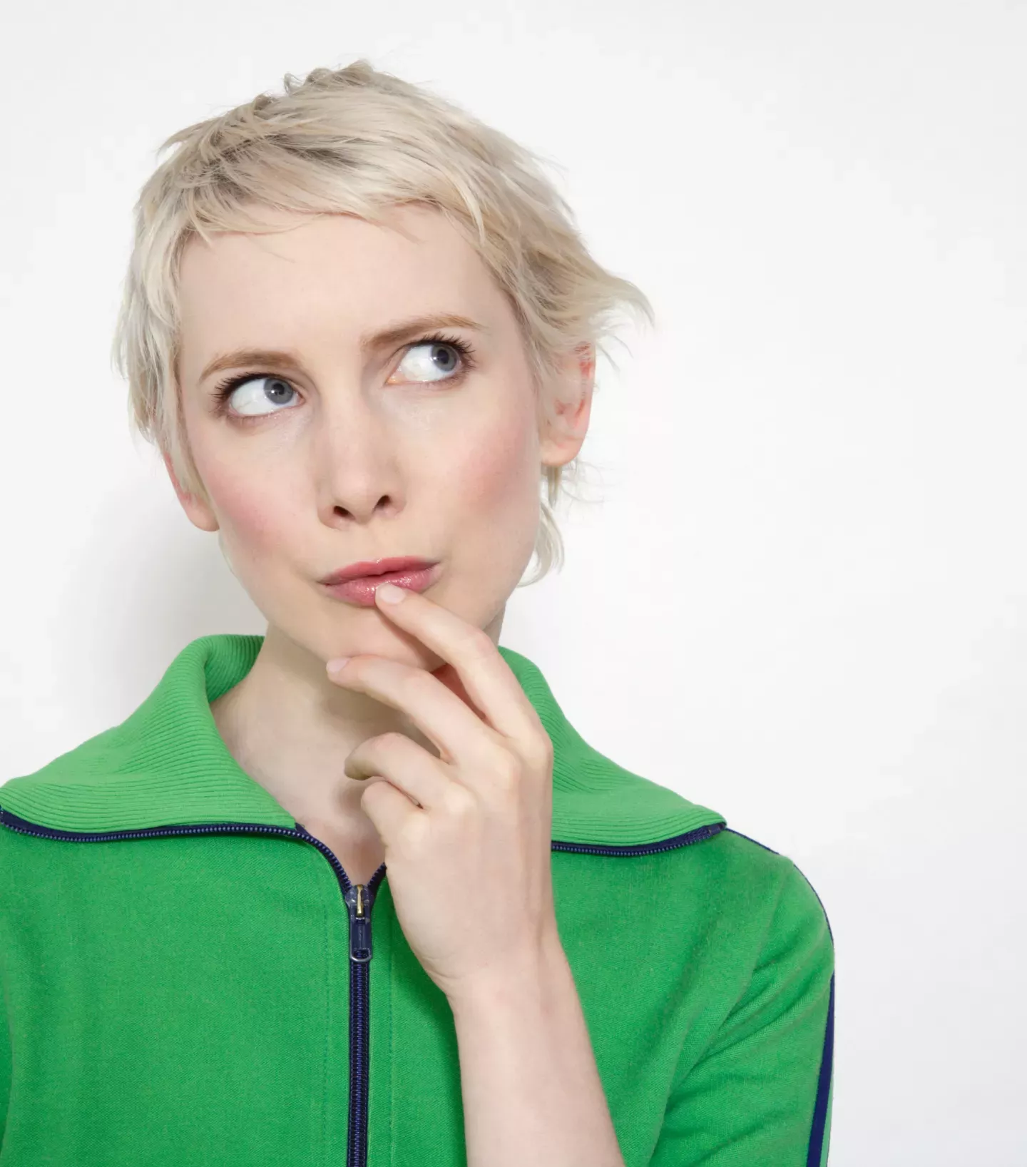 Woman in a green sweater thinking