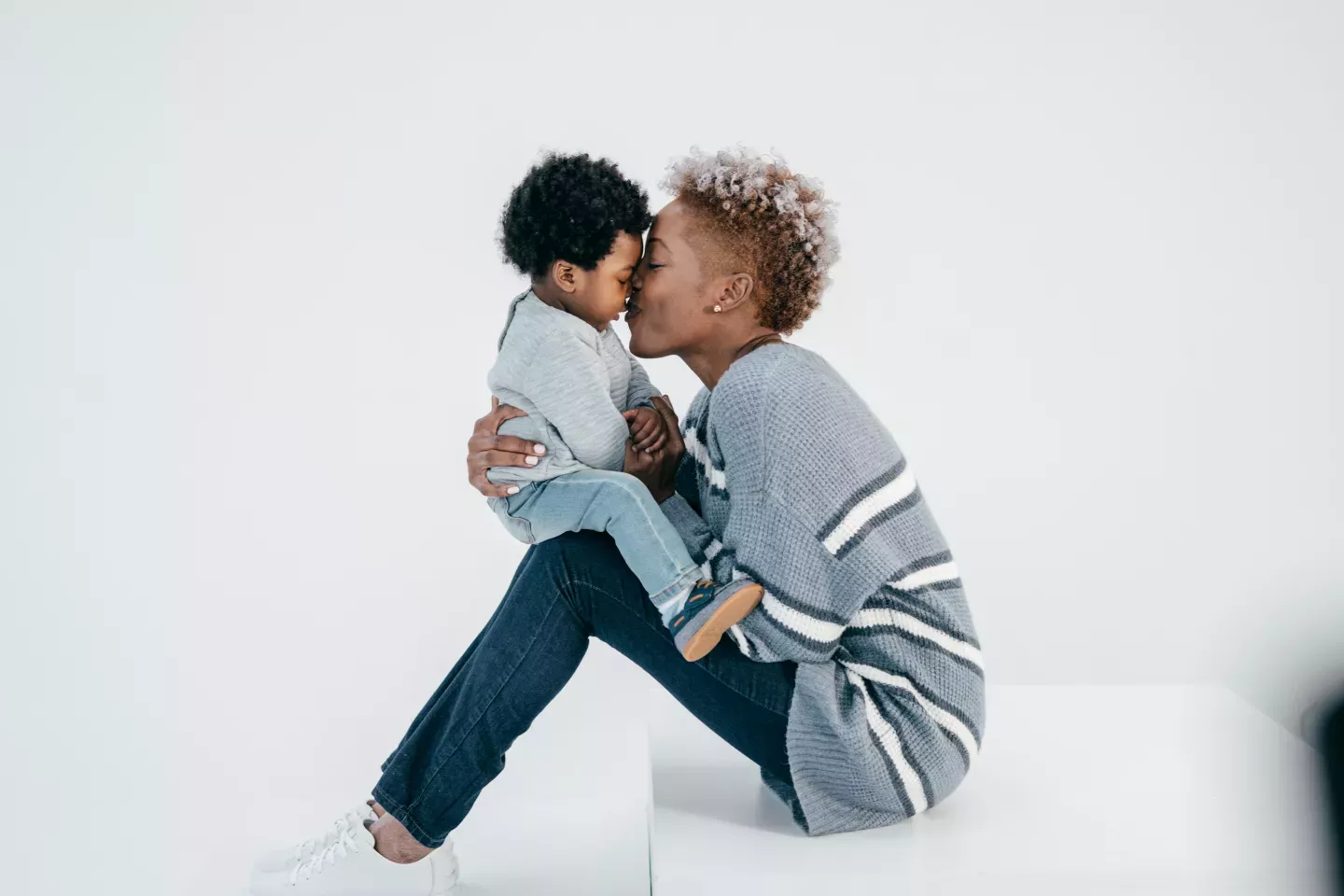 mother nuzzling young child