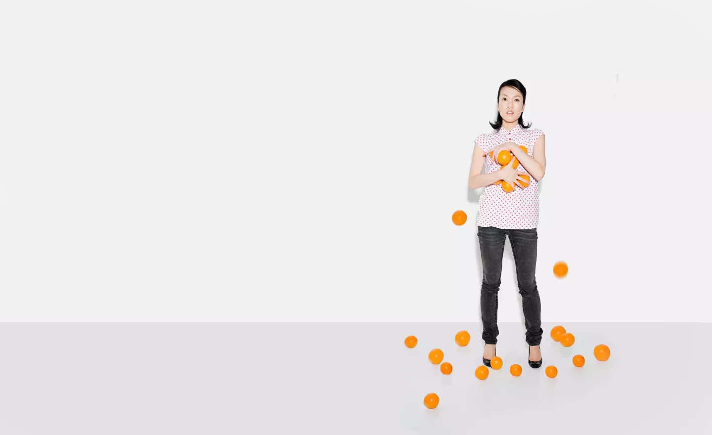 Woman holding oranges