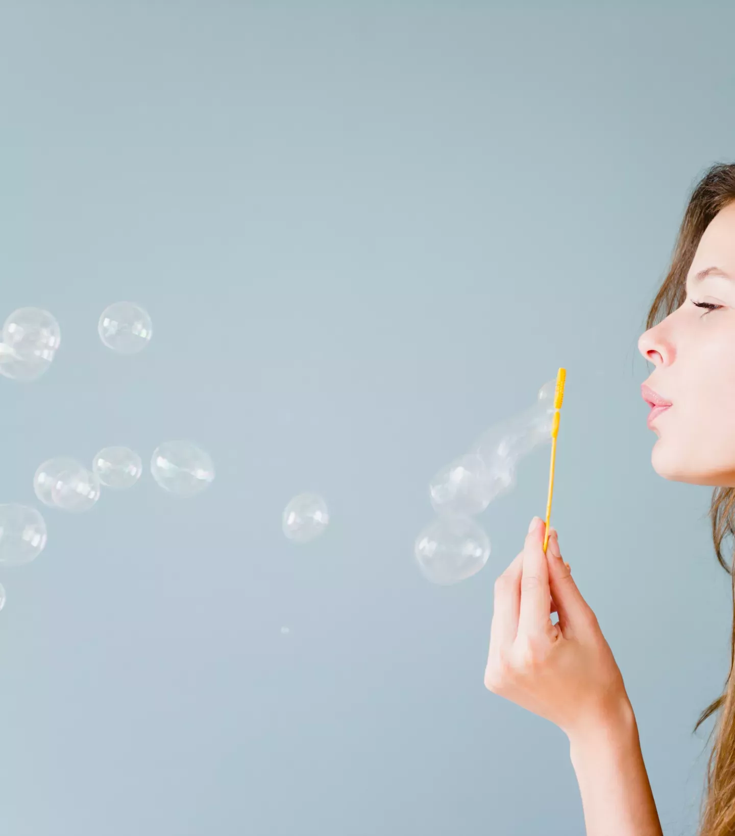 Woman blowing bubbles