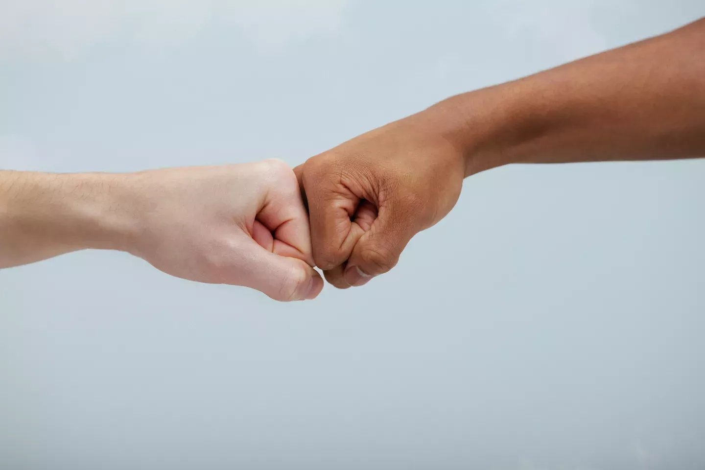 Two people giving a fist bump