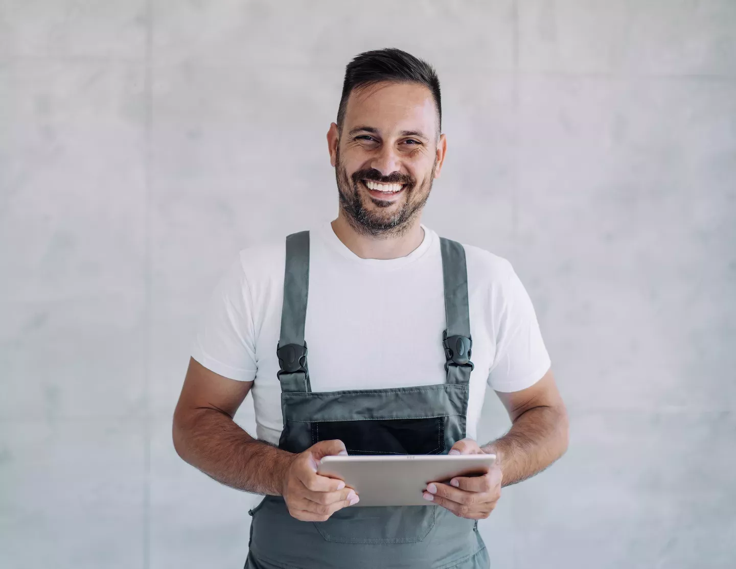 Mechanic holding a tablet