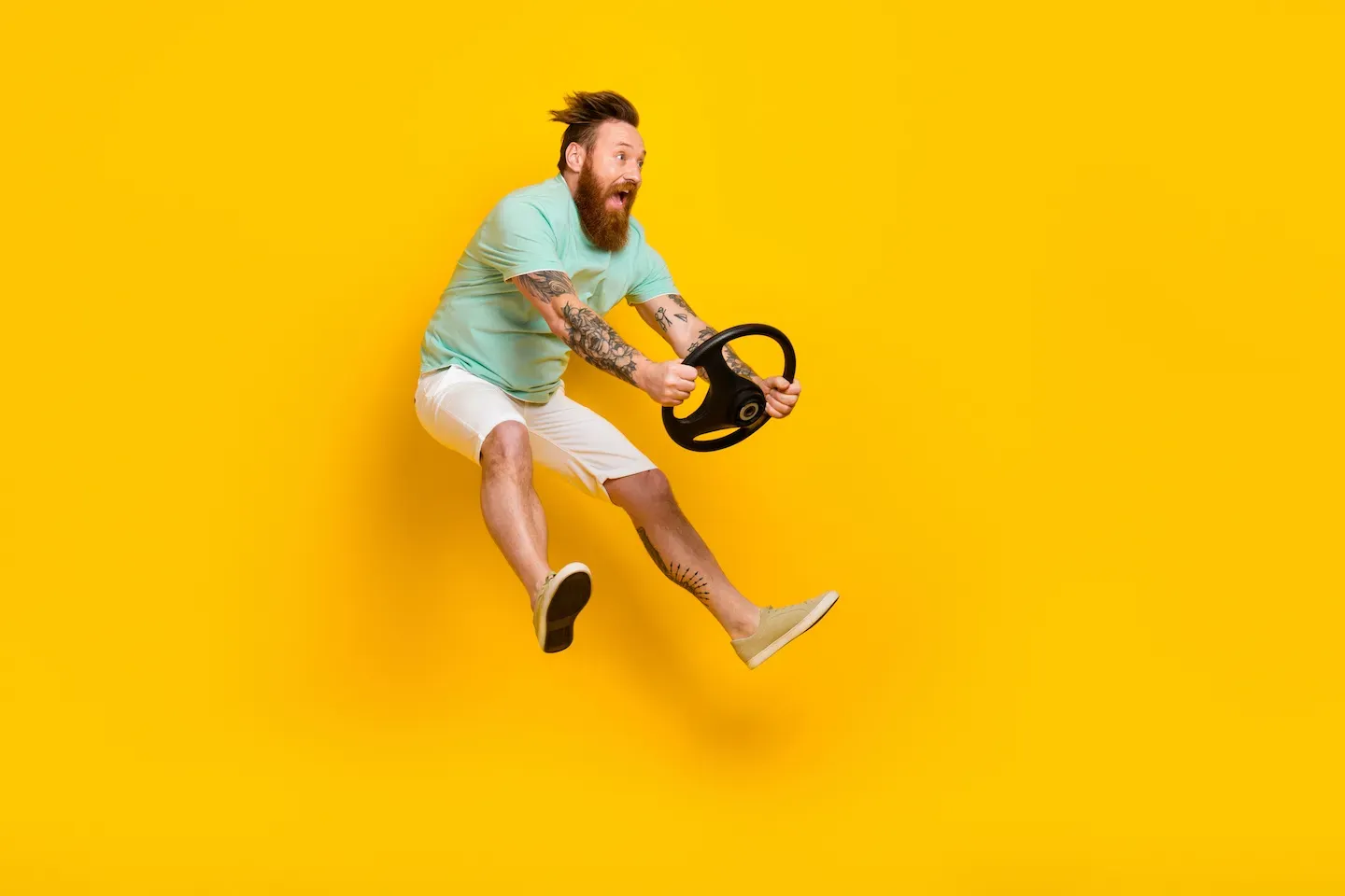 Man holding on to a steering wheel Man holding on to a steering wheel