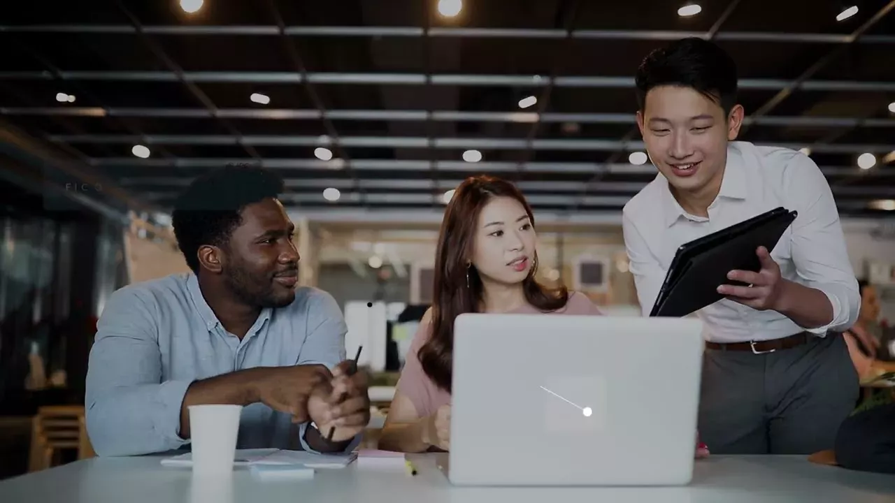 three people working together