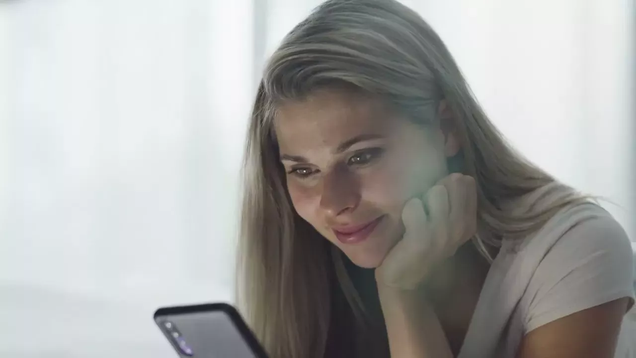 woman looking at phone