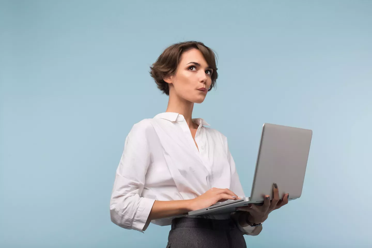 woman holding laptop woman holding laptop