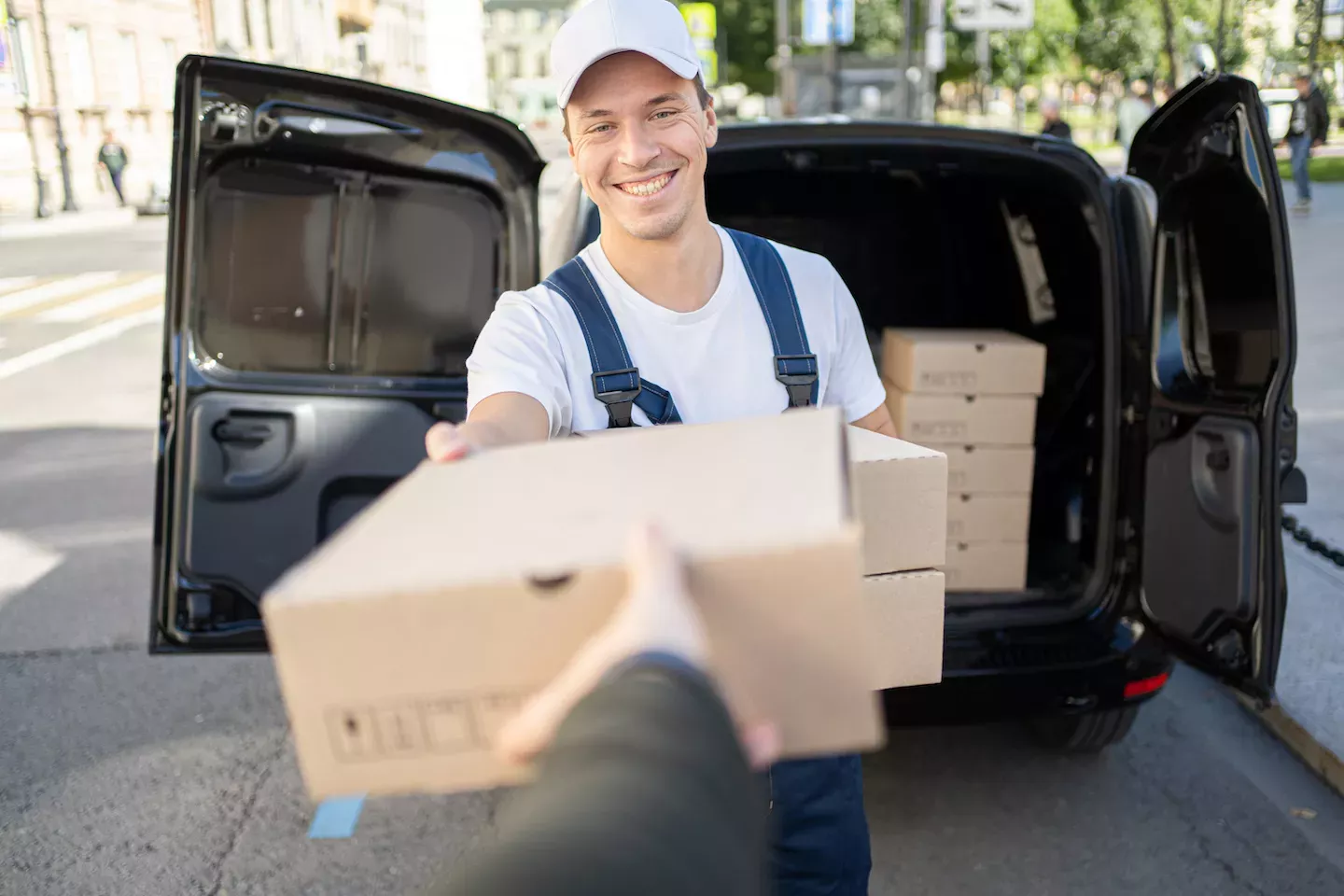 Delivery person handing customer a box Delivery person handing customer a box