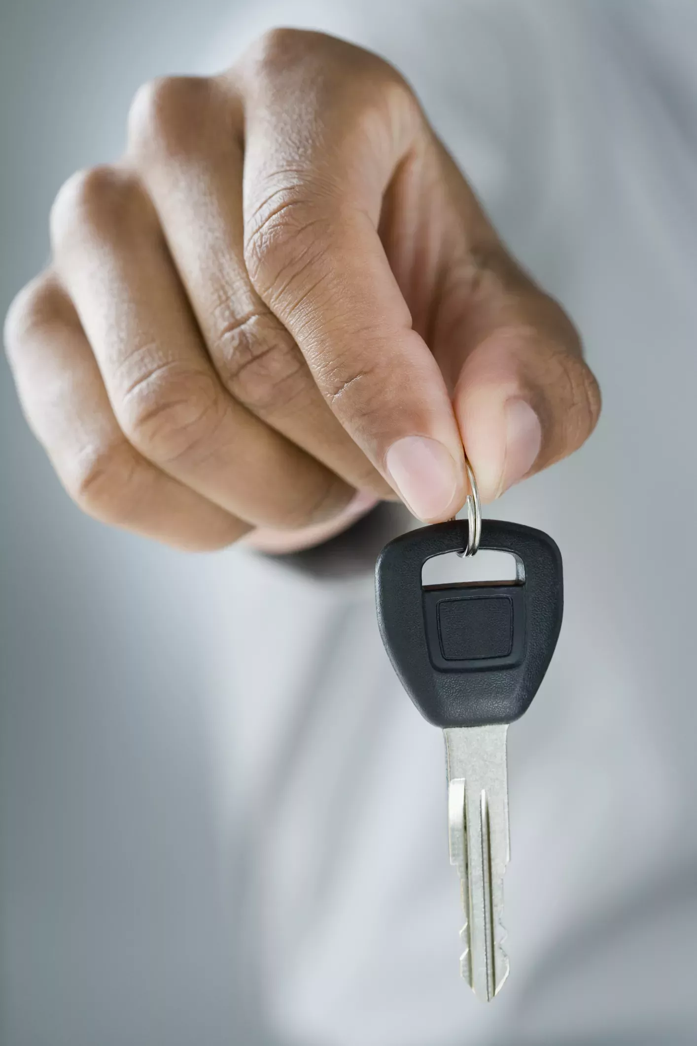 hand holding car key hand holding car key
