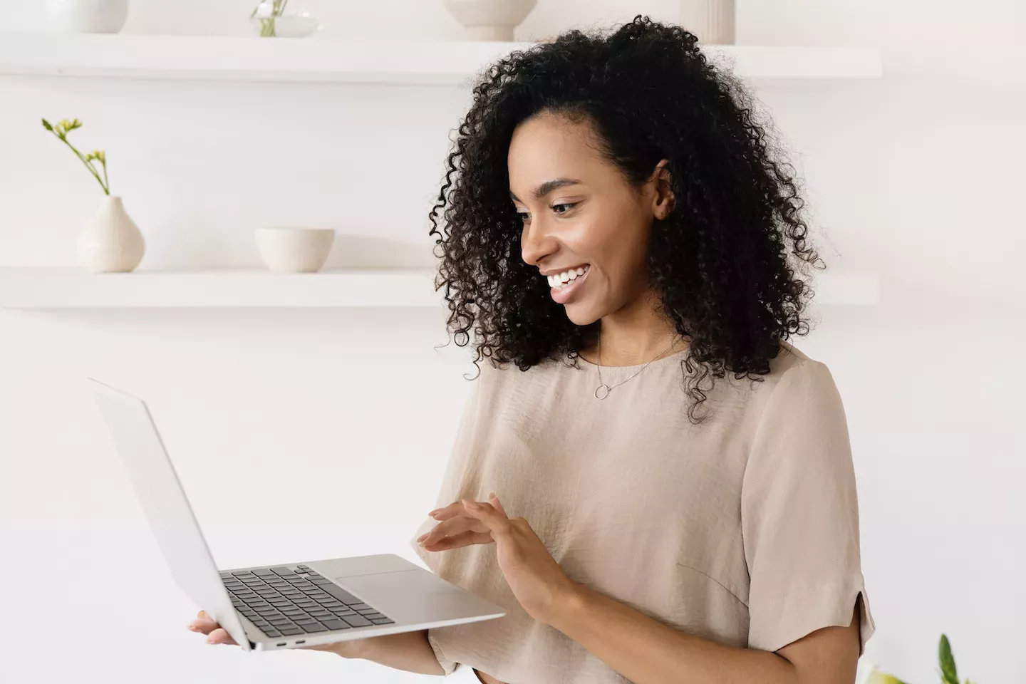 Woman looking at laptop