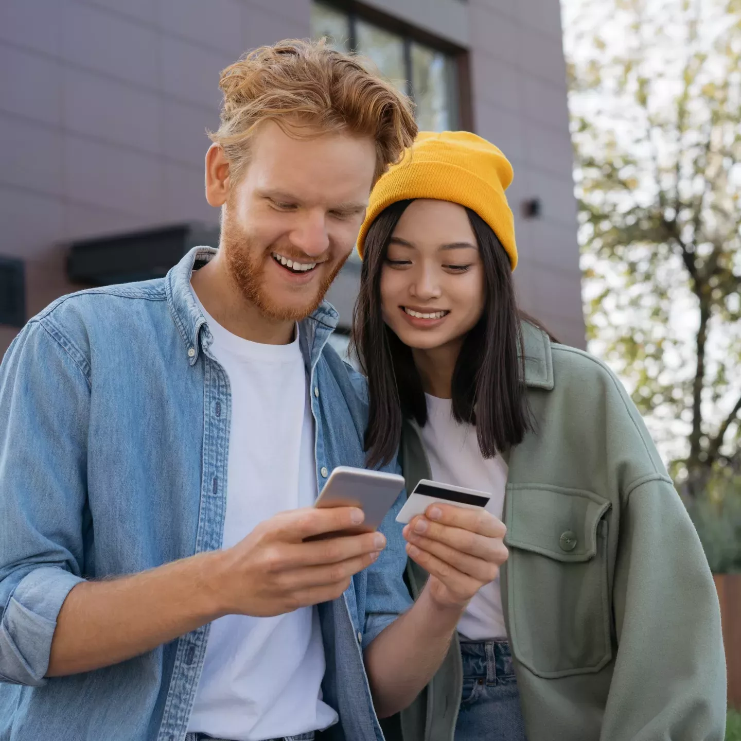 Couple on phone with card Couple on phone with card