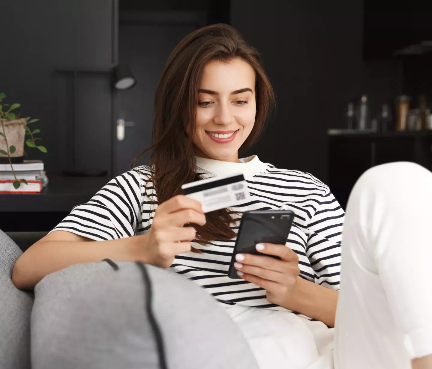 Woman with phone and card Woman with phone and card
