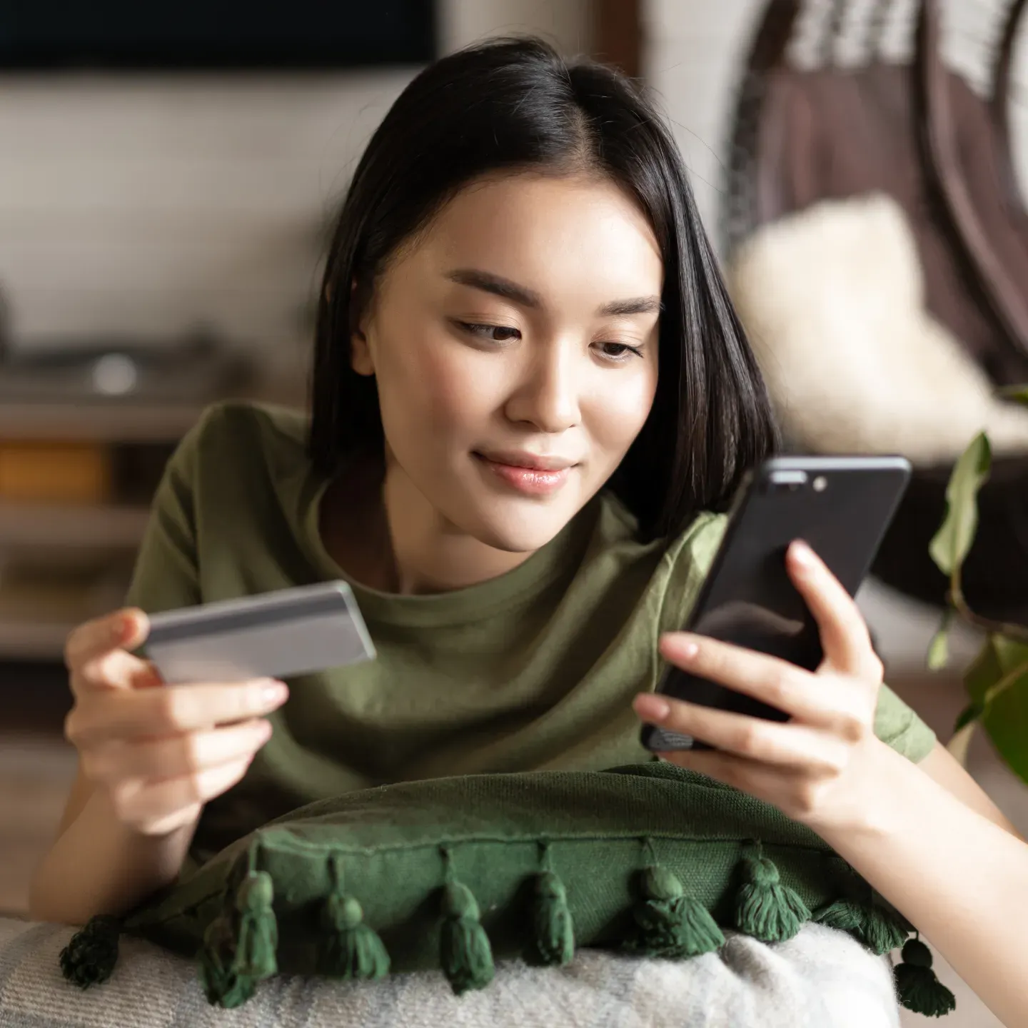 Woman with phone and card Woman with phone and card