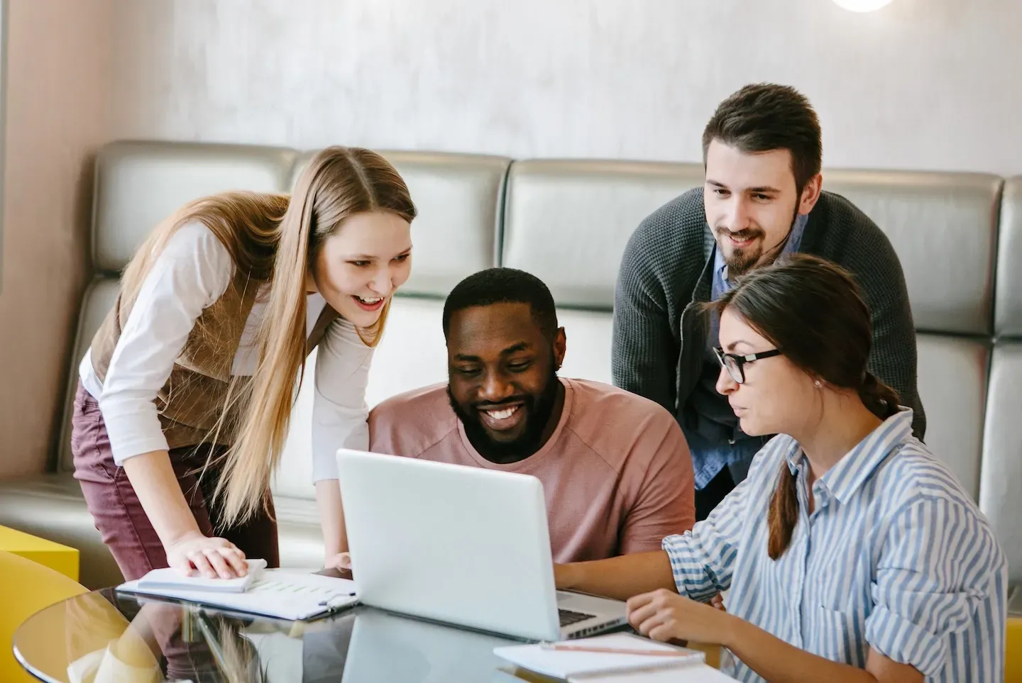 group of people looking at computer