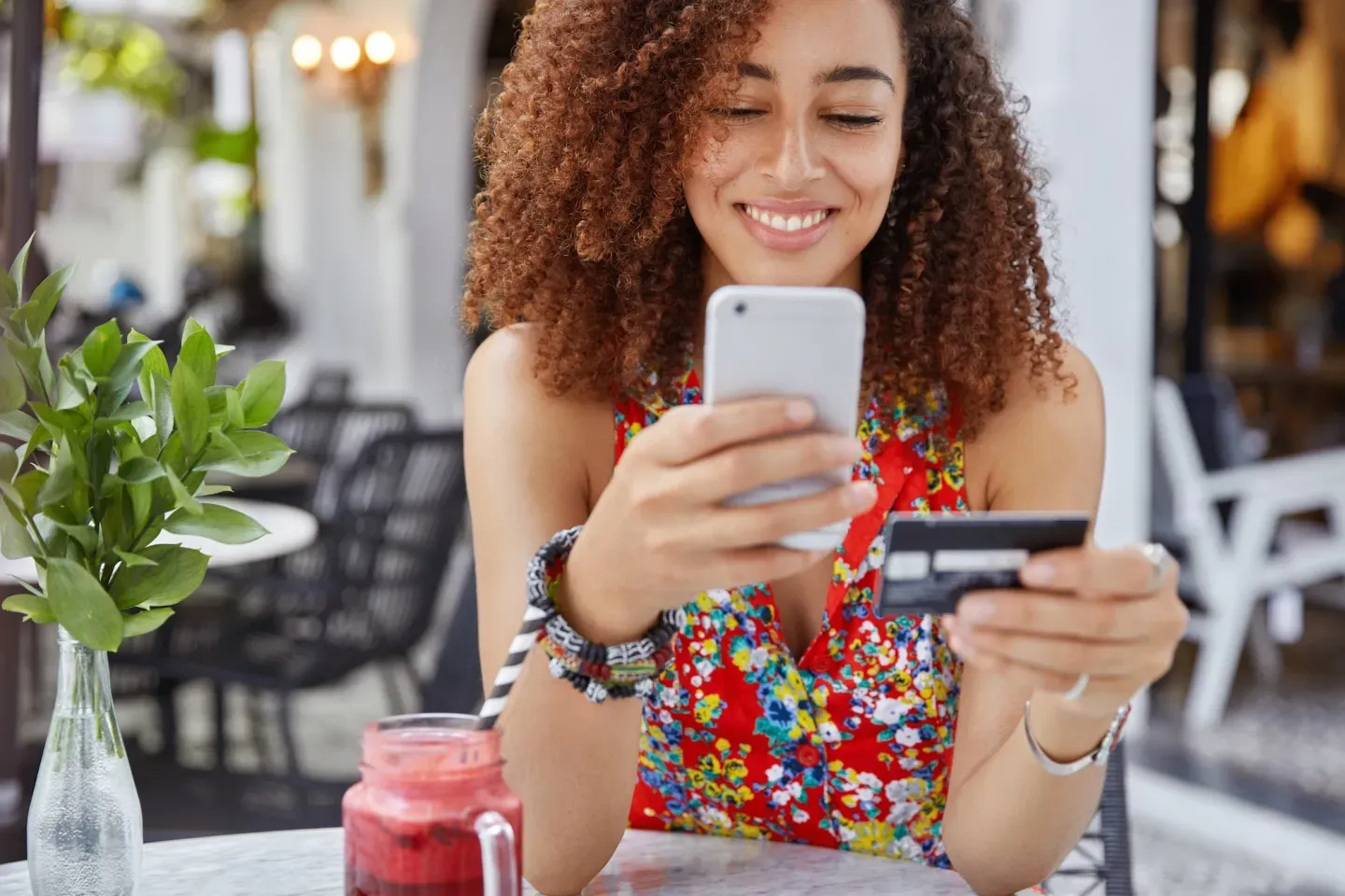 Woman with phone and card