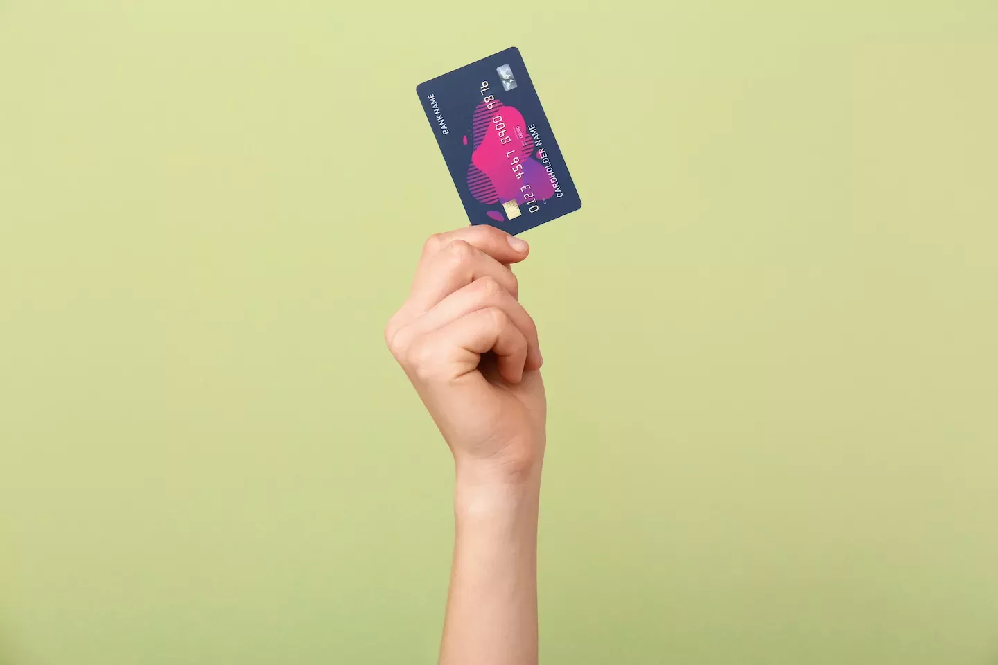 Hand holding a credit card Hand holding a credit card