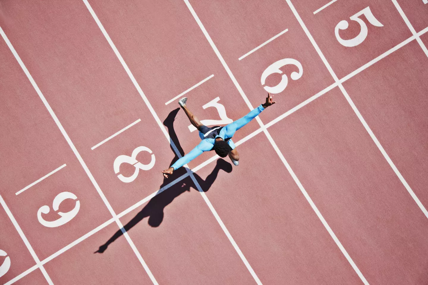 Person running a race on a track