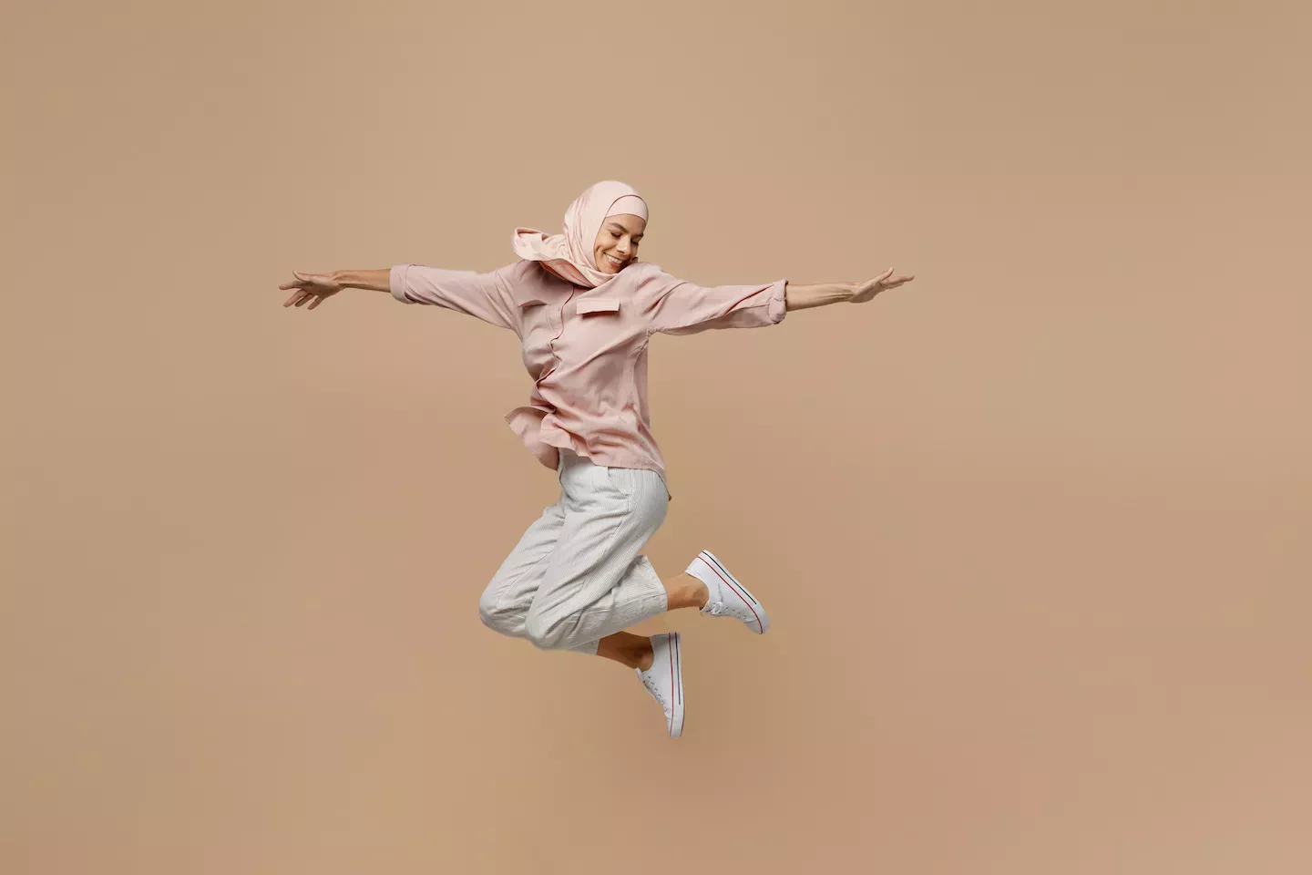 Woman leaping in the air Woman leaping in the air