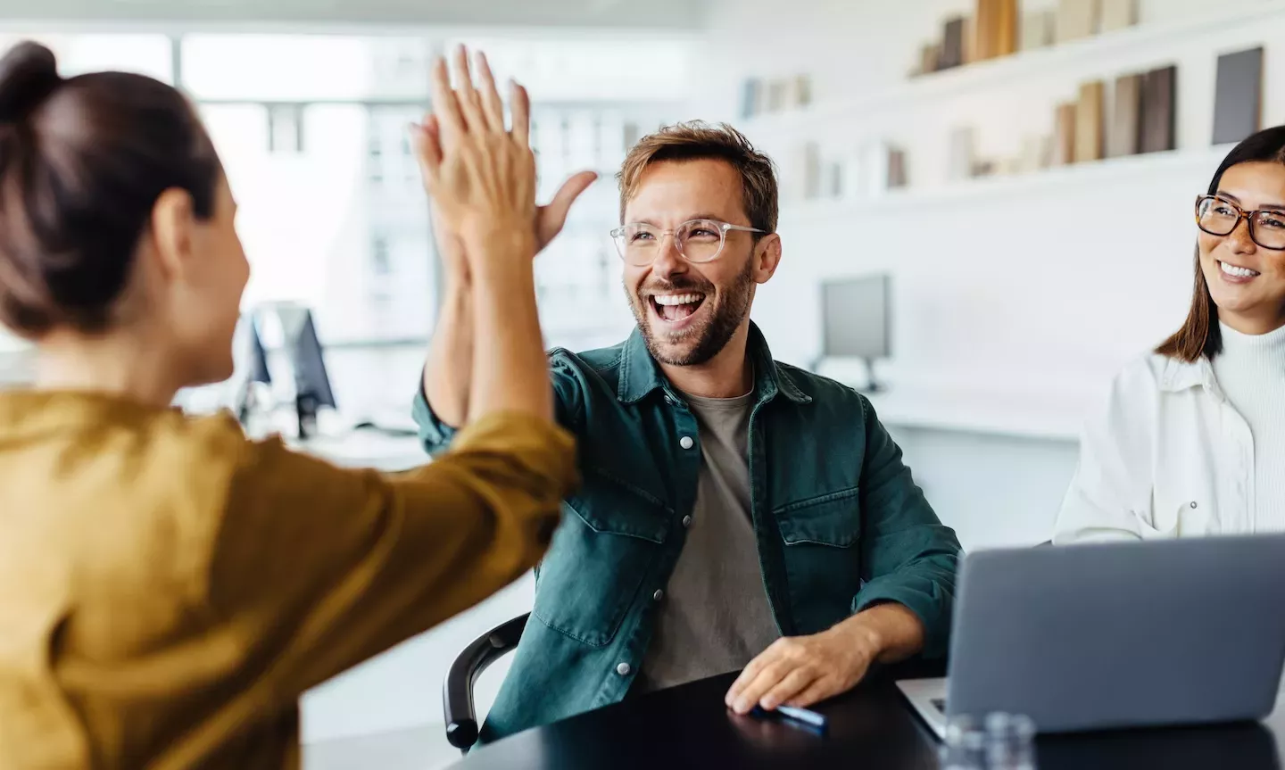 two people high fiving