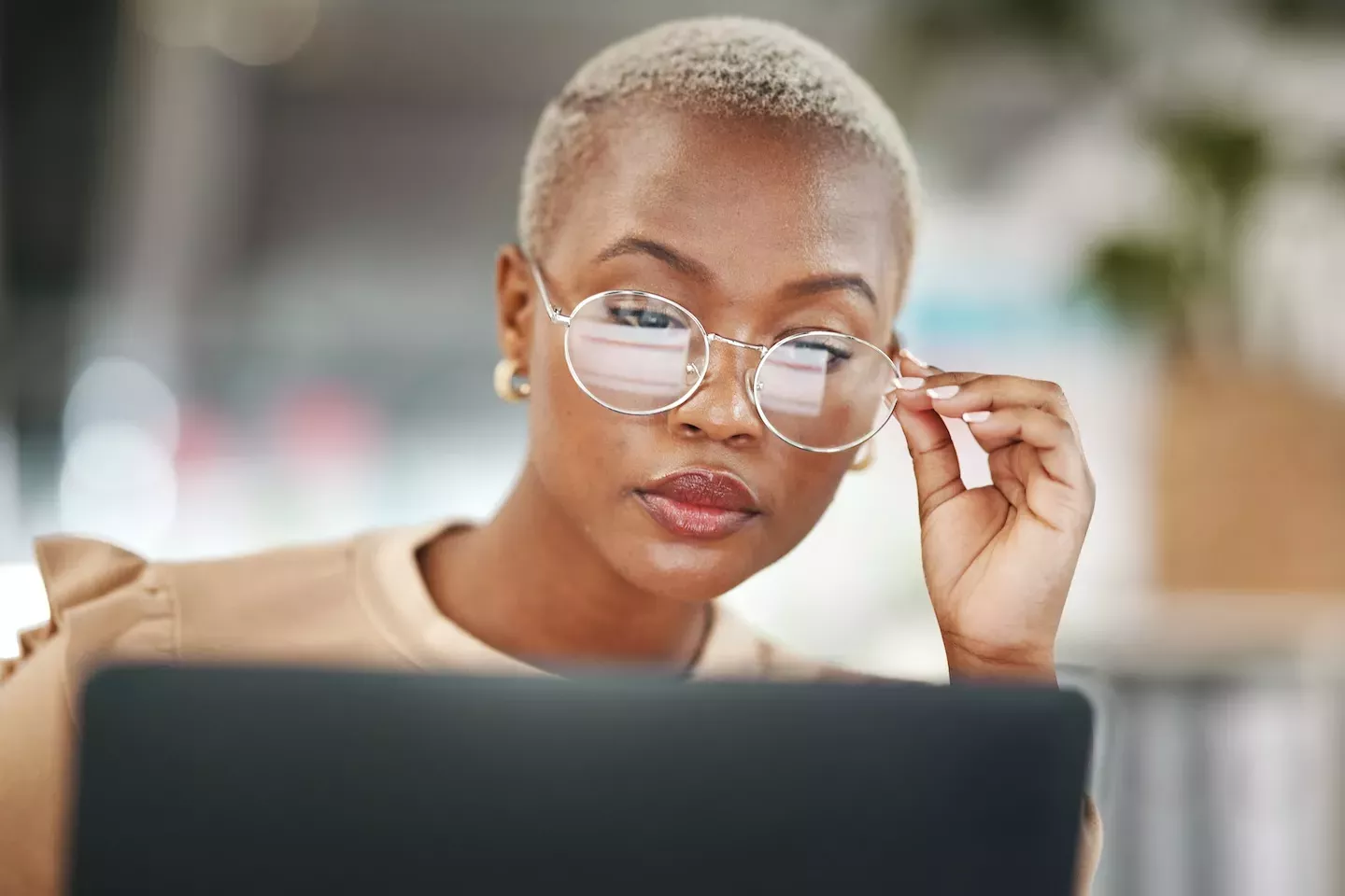 Woman looking at laptop