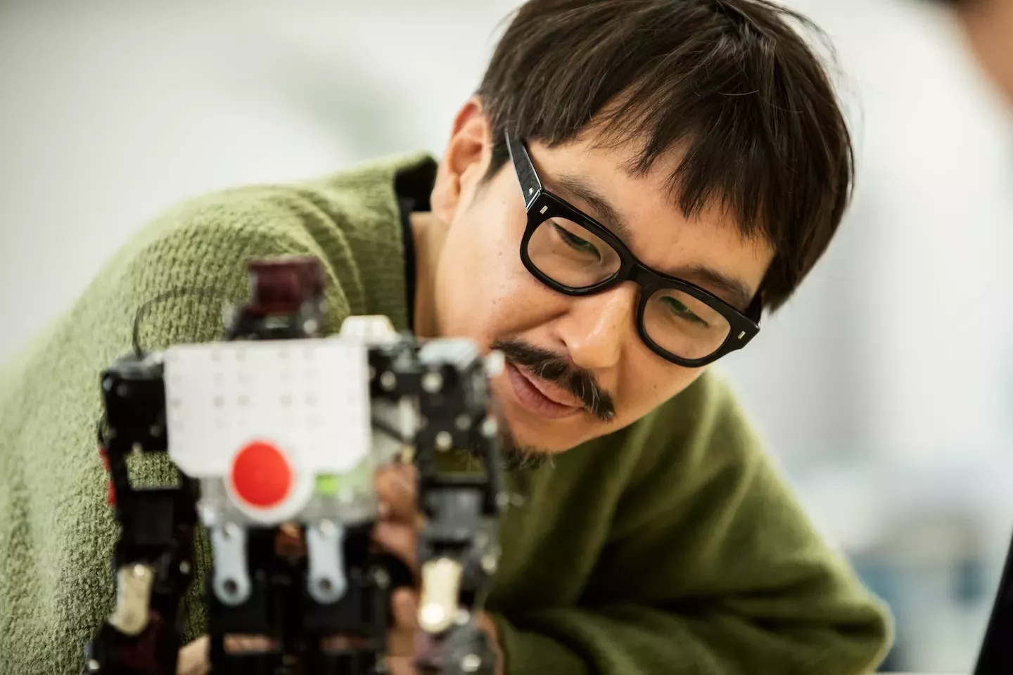close up of a man working with technology