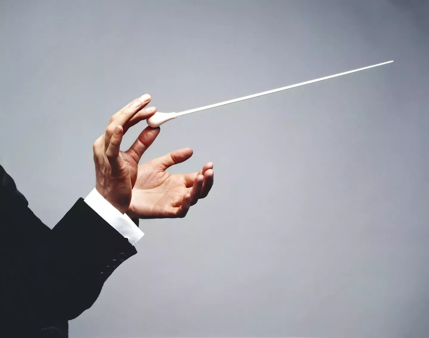 two hands conducting music