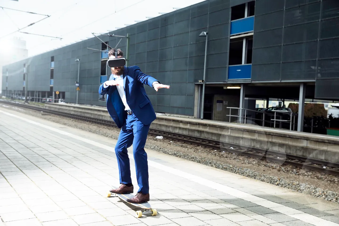 business man on a longboard wearing a vr headset